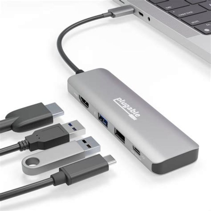 Can I use a USB hub to plug in a lot of USB drives with profile and save game data in the Xbox 360?