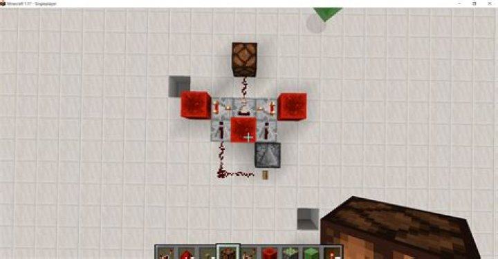 How would I create a circuit that gives an output similar to the one of a button when a block behind is powered with a lever but not when not powered?