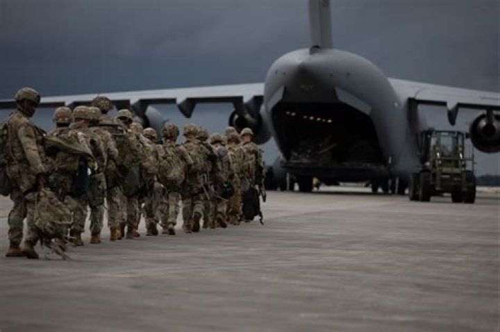 What determines when base troops are discarded?